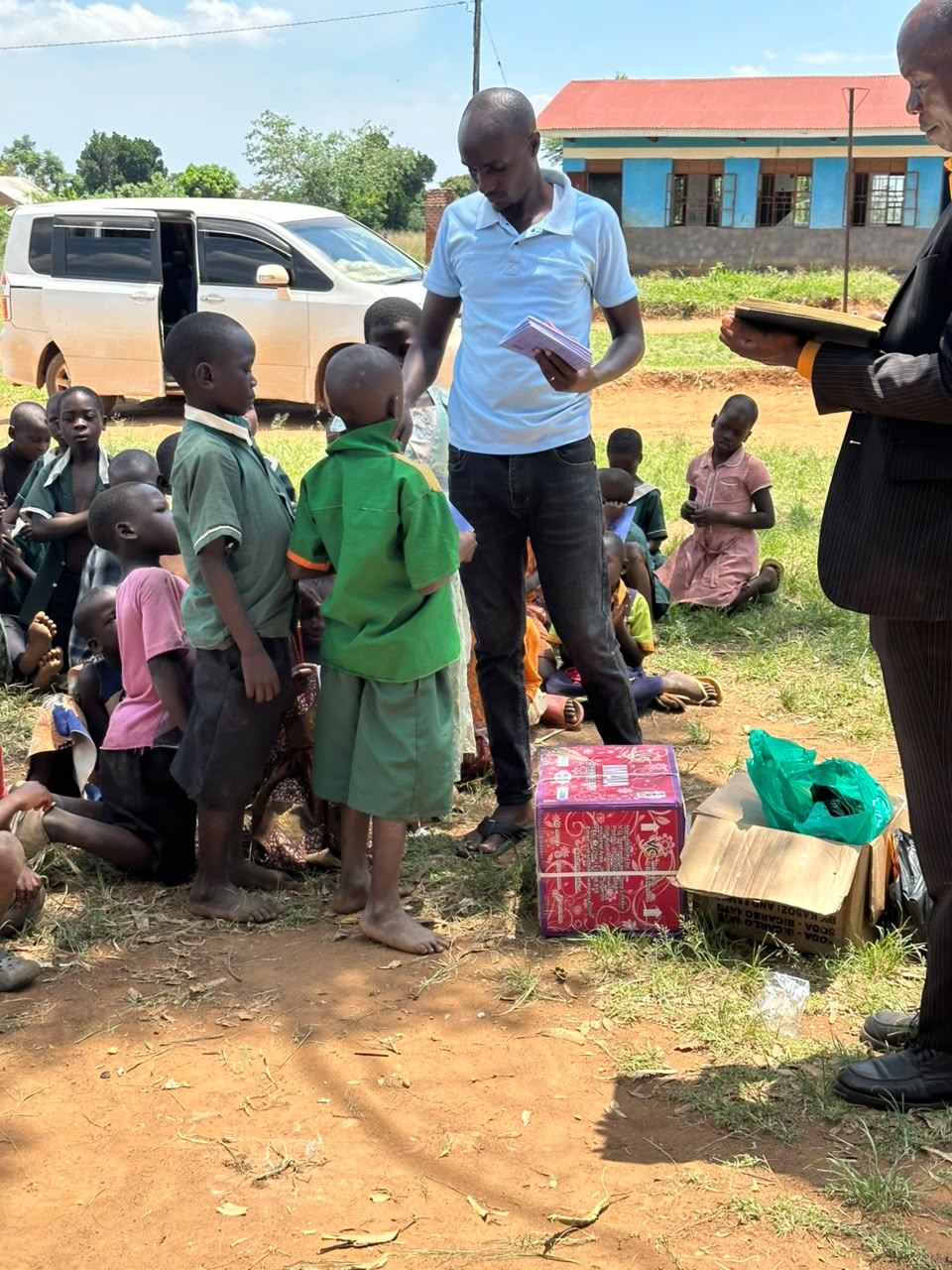 Team members speak with pupils during a school visit