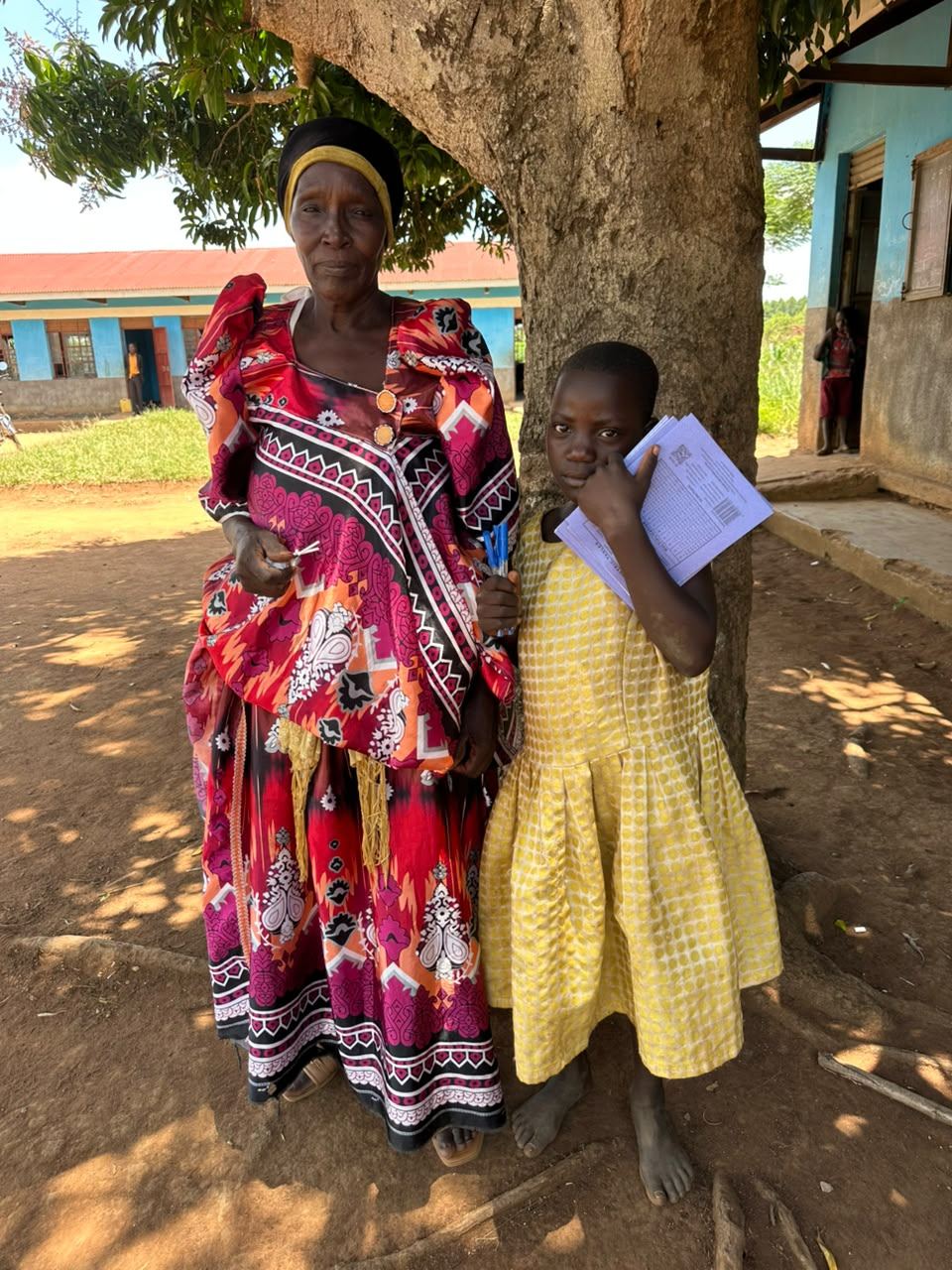 A mother stands with her daughter holding a new book